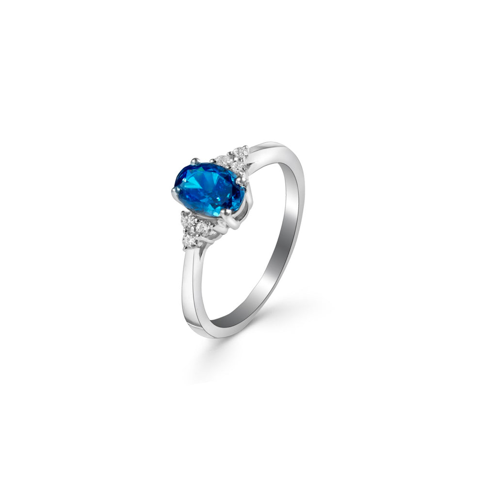 
                  
                    Elegant rhodium-plated ring by Klarity with oval-cut blue zirconia
                  
                