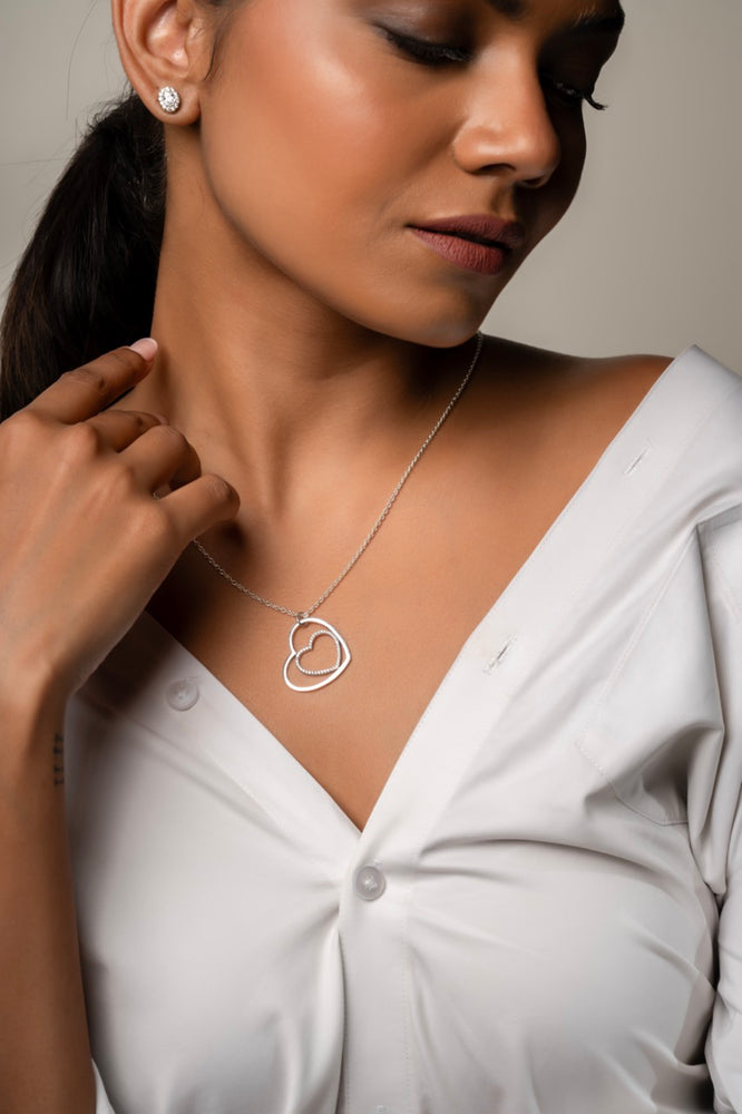 
                  
                    Sterling silver long necklace with double heart charm and zirconia sparkle
                  
                