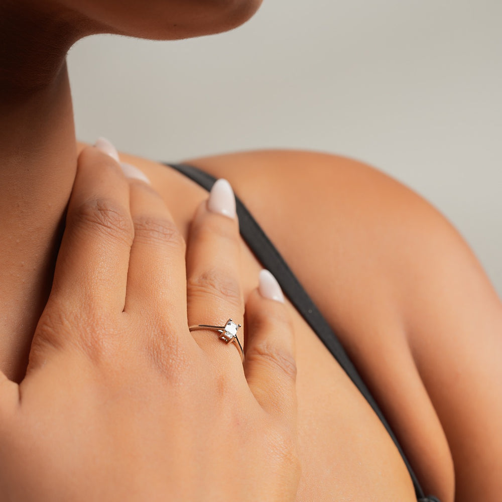 
                  
                    Sterling silver solitaire ring by Klarity featuring an emerald-shaped stone
                  
                