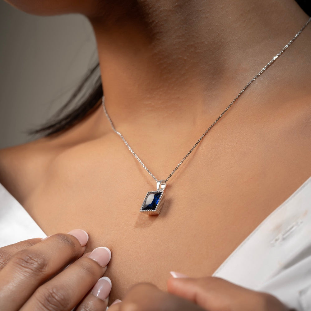 Bold rectangular blue stone pendant by Klarity with silver-tone detailing