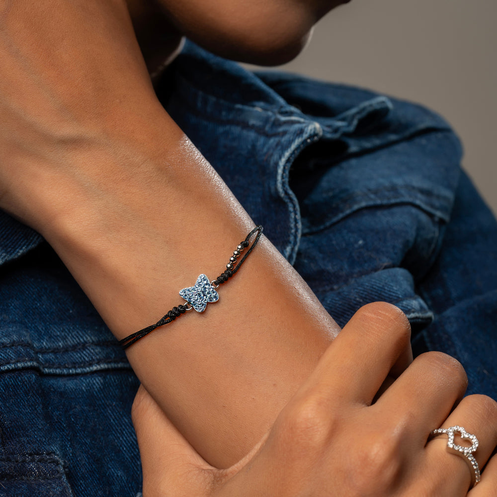 Sterling silver cord bracelet with blue CZ butterfly and silver beads – Klarity