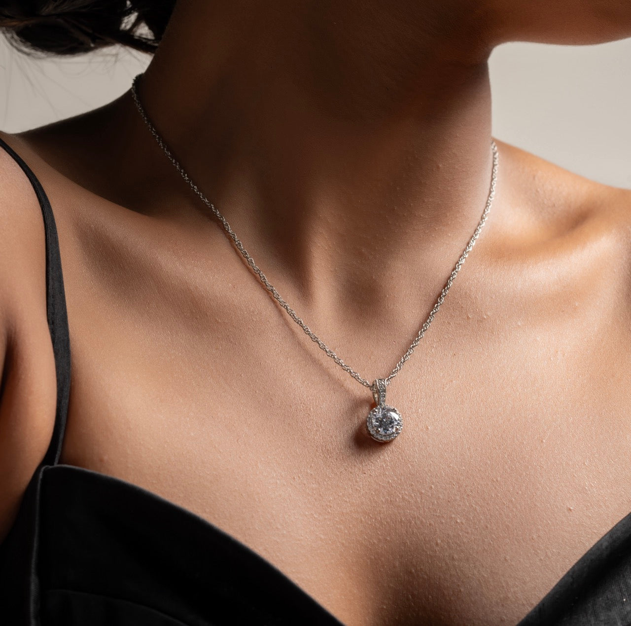 Close-up of rhodium-plated halo setting enhancing center CZ stone