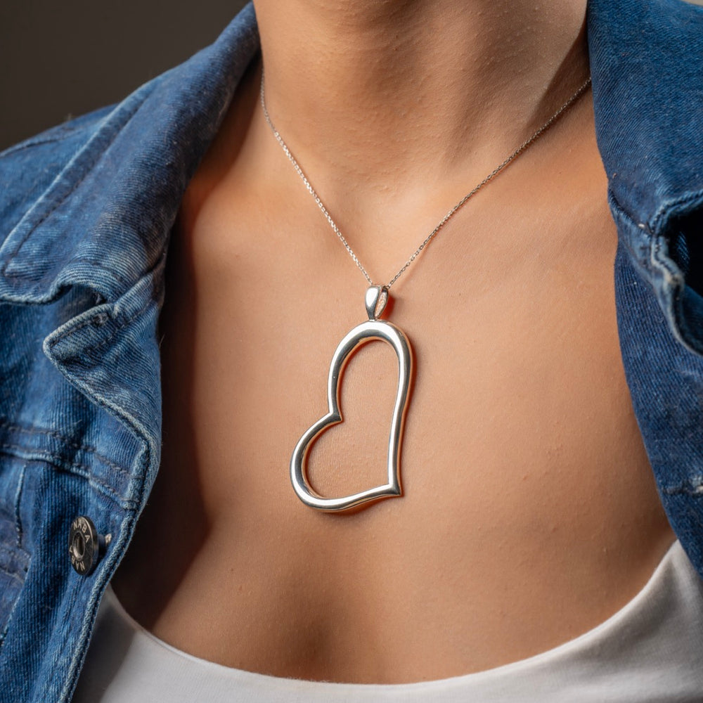 Modern silver heart pendant by Klarity symbolizing strength and self-love