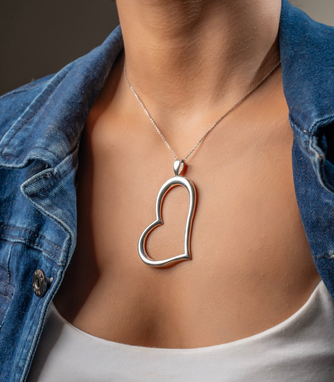 Modern silver heart pendant by Klarity symbolizing strength and self-love