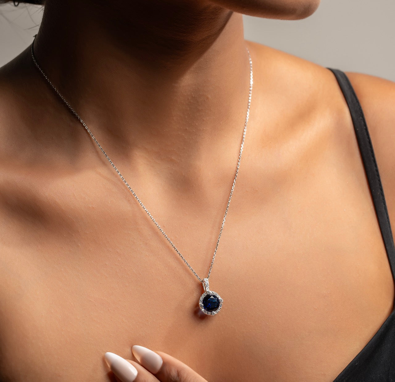 Elegant purple and blue halo pendant by Klarity featuring shimmering zirconia accents

