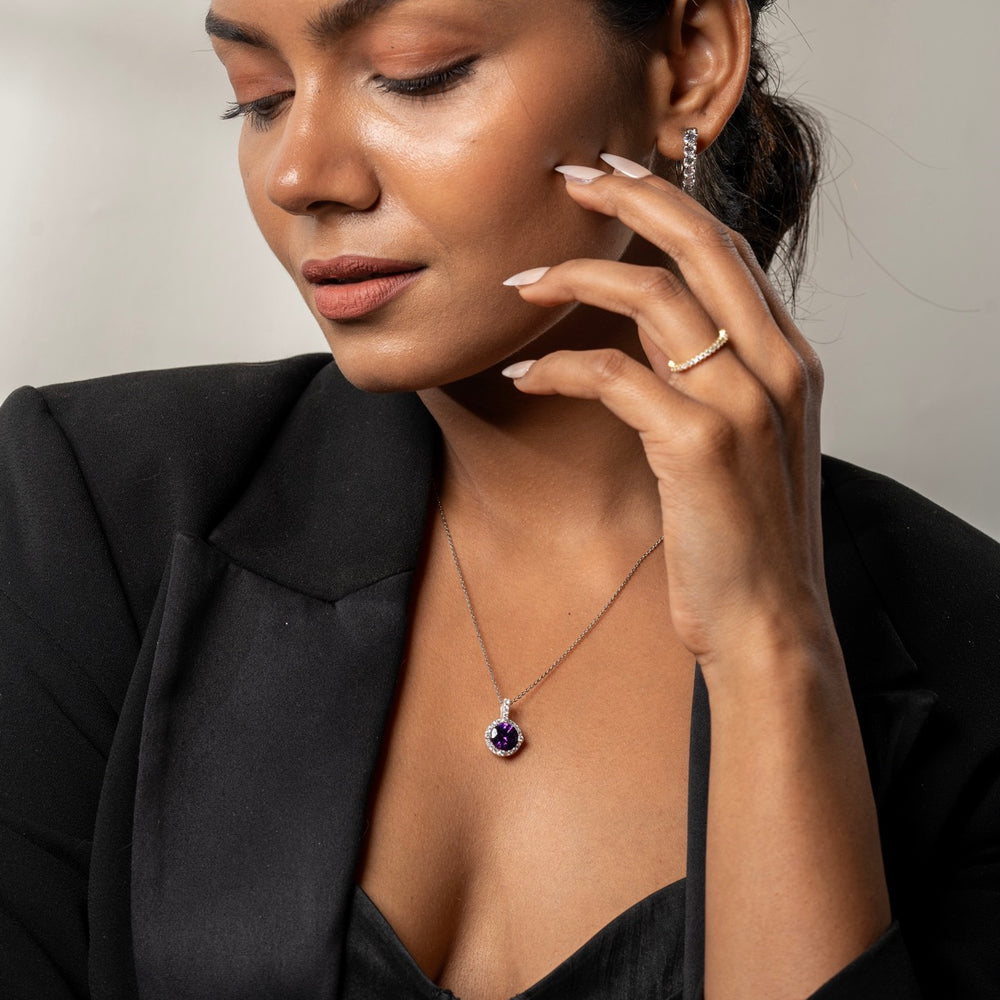 
                  
                    Statement halo pendant with deep blue/purple center stone by Klarity
                  
                