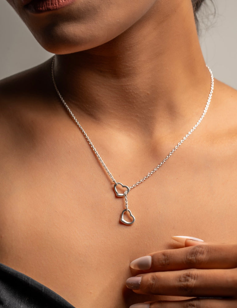 Sterling silver intertwined heart necklace by Klarity with elegant lariat drop