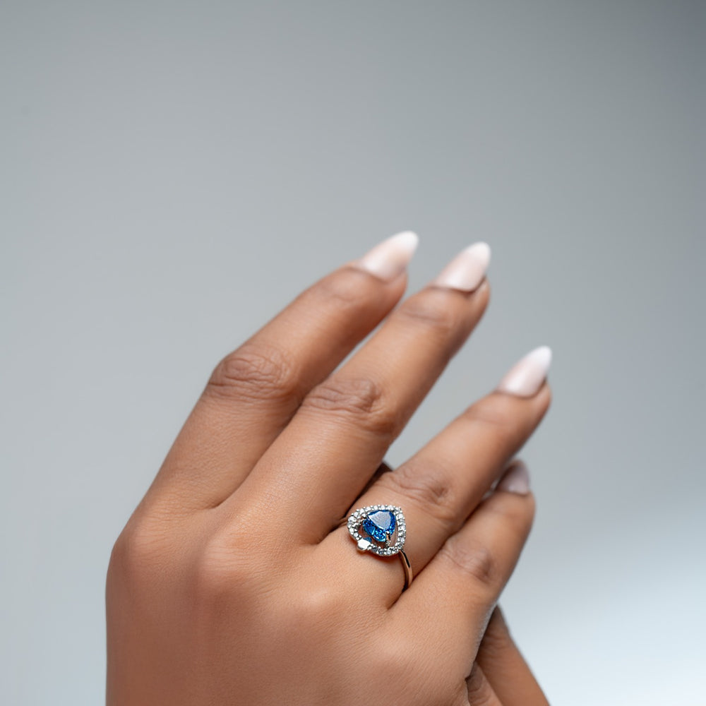 
                  
                    Elegant silver ring with heart gem and halo sparkle, designed by Klarity


                  
                