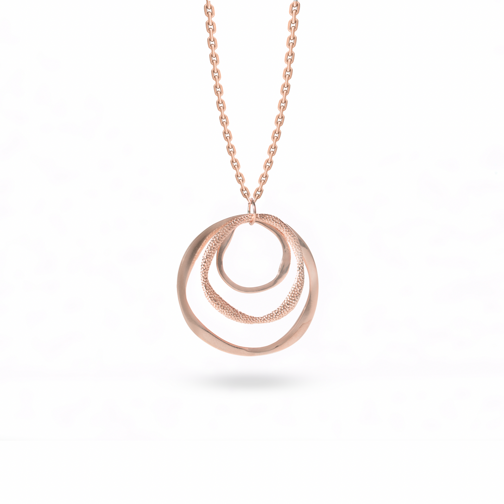 Klarity’s rose gold plated layered circle pendant showing polished/matte contrast