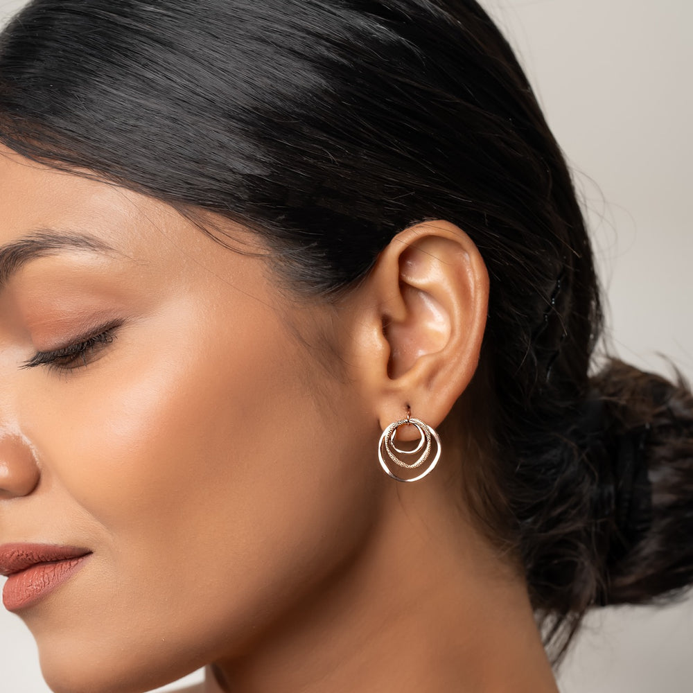 
                  
                    925 silver circular stud earrings with rose gold finish, perfect for everyday elegance
                  
                
