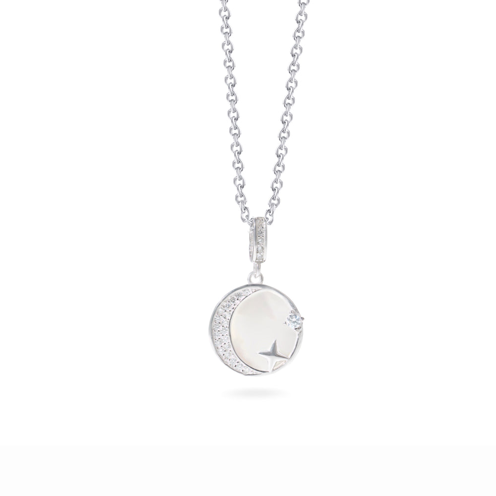 Klarity’s celestial pendant with CZ stars and mother of pearl moon on silver chain