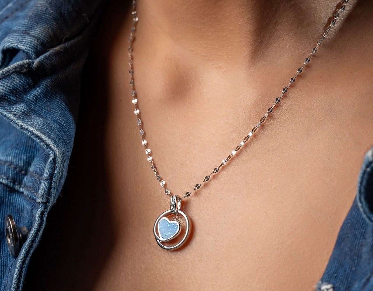 Styling Klarity's blue opal heart necklace with a white linen dress for brunch