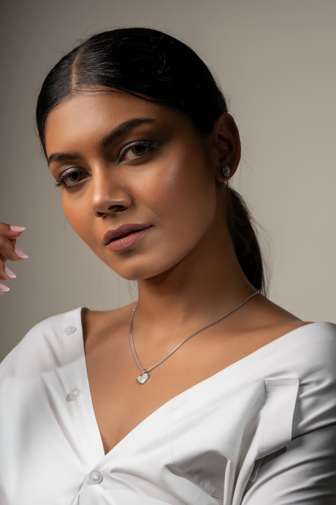 
                  
                    Pearl heart pendant layered with delicate chain for everyday elegance
                  
                
