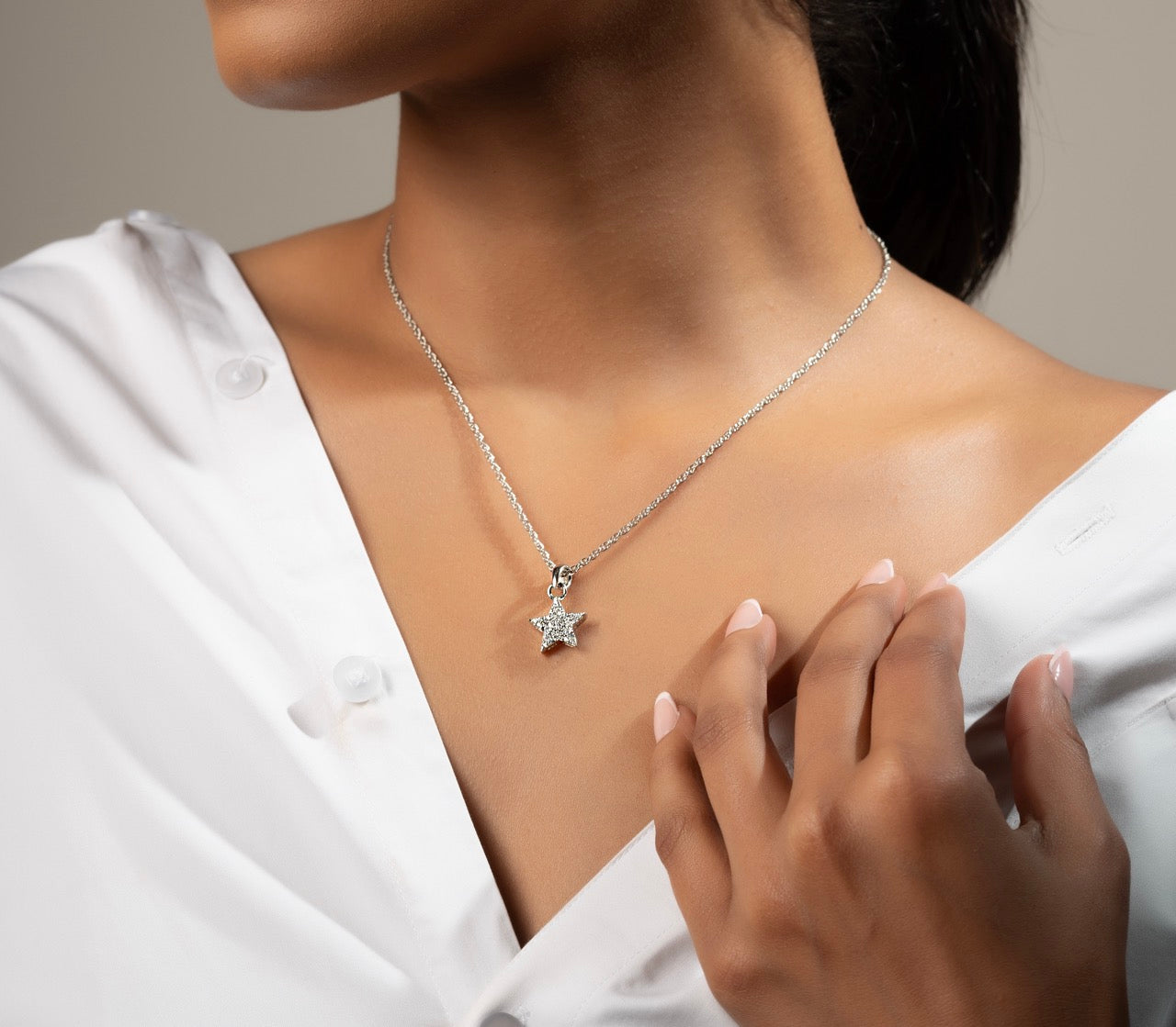 Star-shaped pendant by Klarity, designed to sparkle with every move