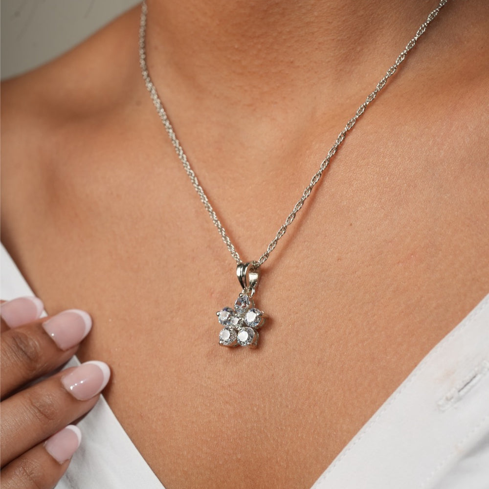 Woman wearing Klarity’s snowflake pendant for Christmas party