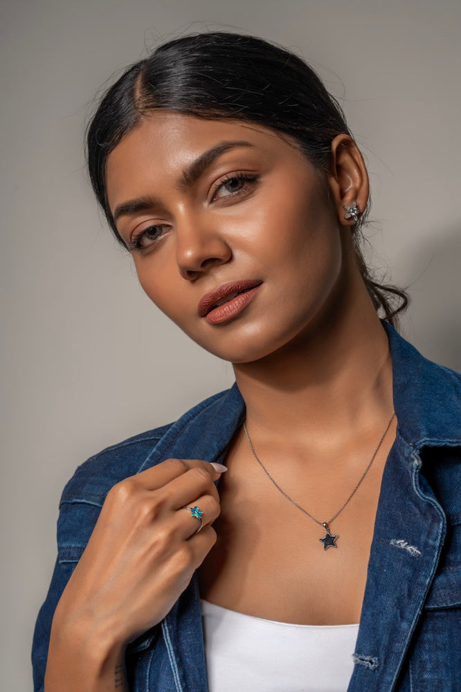 
                  
                    Close-up of precision-cut raised borders on Klarity’s black star pendant
                  
                